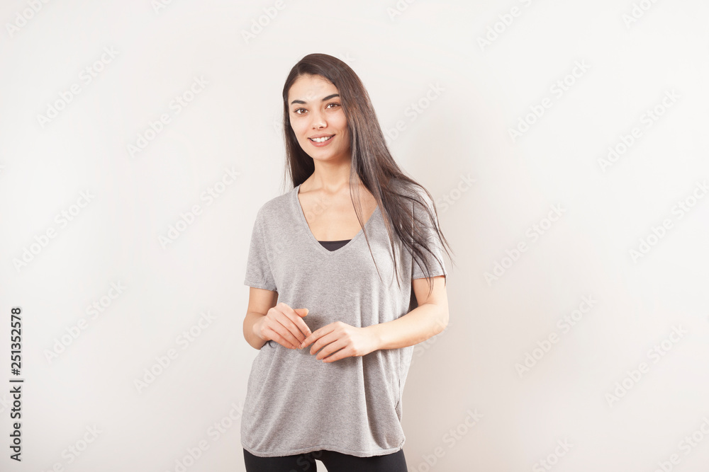 Young beautiful portrait woman on gray background Young beautiful portrait woman on gray background