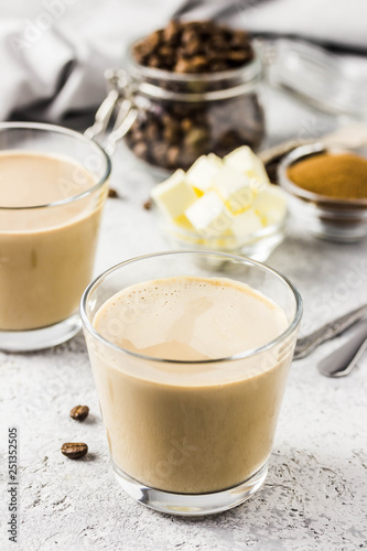 Cinnamon bulletproof coffee in glasses. Selective focus, space for text.