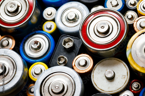 Bild auf Leinwand Used Alkaline batteries toxic waste recycling and ecology issues concept backgro