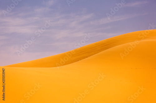 Desert Sahara with beautiful lines and colors at sunrise. Merzouga  Morocco