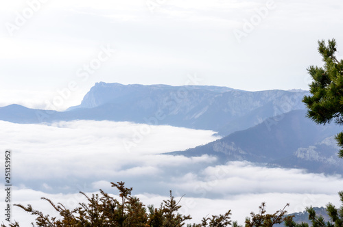 above the clouds, the mountains in the clouds.  © Олег Кононов