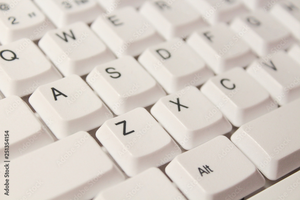 White computer keyboard. Close-up. Background. Texture. White computer keyboard. Close-up. Background. Texture.