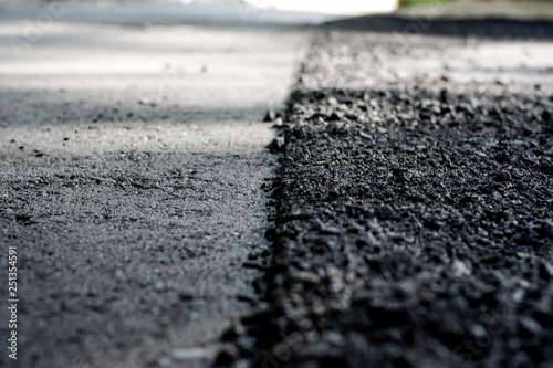 Laying of new asphalt. The new road. Road repair street.