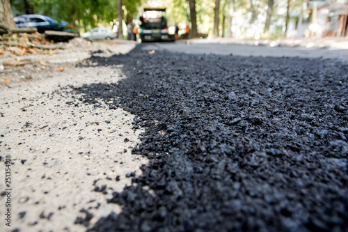 Laying of new asphalt. The new road. Road repair street.