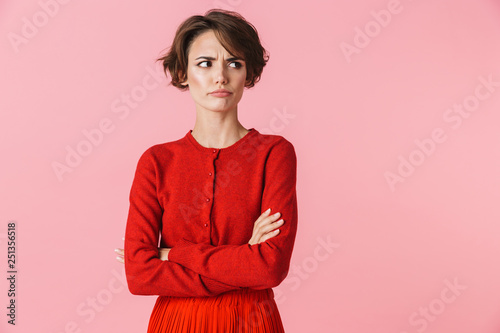 Tableau sur toile Portrait of a beautiful young woman wearing red clothes