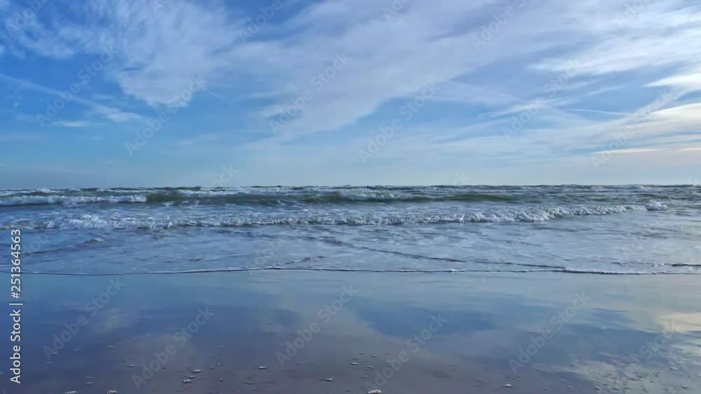 Sea Waves in the beach with clouds slow motion Sea Waves in the beach with clouds slow motion