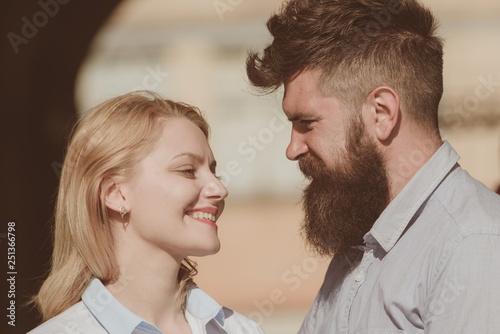 Happy to be in love. Couple in love on summer day. Loving couple of woman and hipster dating outdoor. Feeling love and romance. Sensual woman and bearded man enjoy romantic date