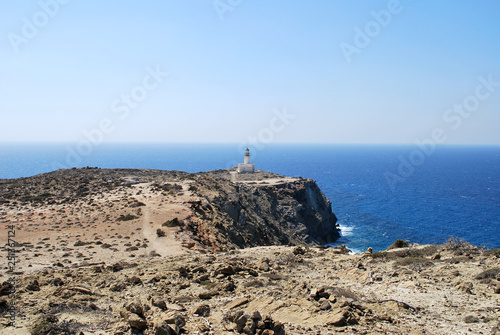 View of the lighthouse on a stone cliff above the sea against the sky, Prasonisi, Rhodes island, Greece © PAVEL