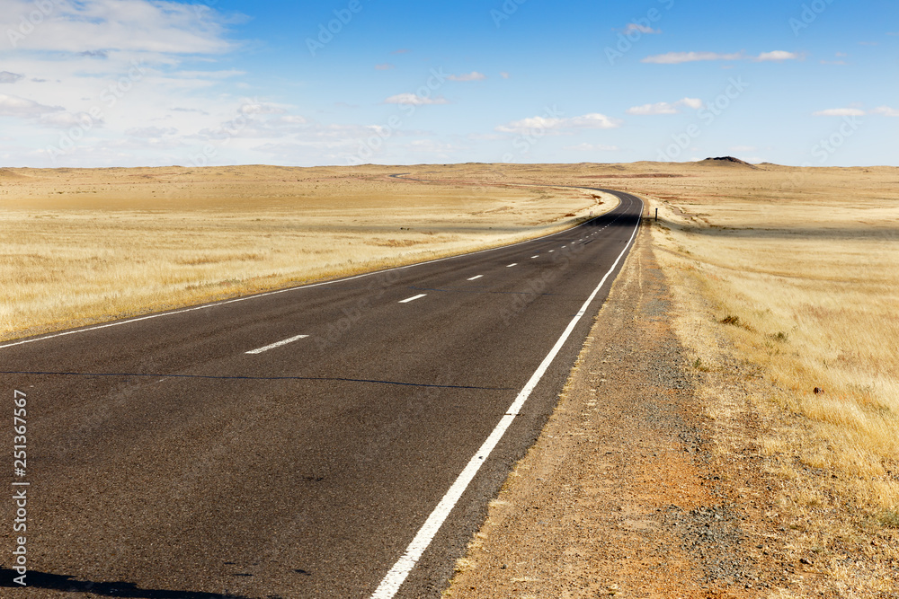 asphalt road Sainshand Zamiin-Uud in Mongolia, beautiful landscape Gobi Desert asphalt road Sainshand Zamiin-Uud in Mongolia, beautiful landscape Gobi Desert