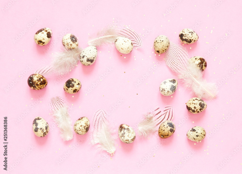 Frame with quail eggs, feathers and and golden glitter on pink background. Frame with quail eggs, feathers and and golden glitter on pink background.