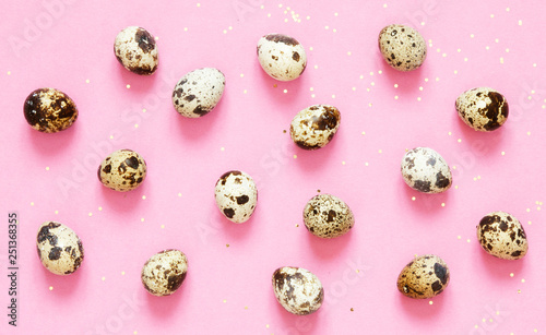  Pattern with quail eggs on pink  background. Happy Easter concept.