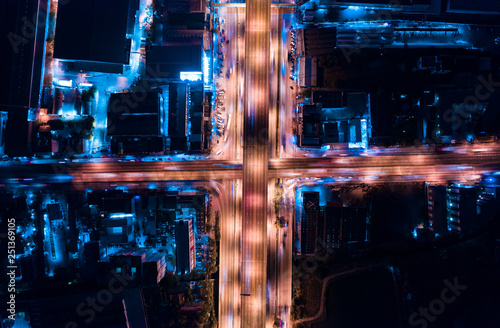 Fototapeta Naklejka Na Ścianę i Meble -  Drone Aerial View of Busy Urban Highway Road Junctions at Night. The Intersecting Freeway Road Overpass The Eastern Outer Ring Road.
