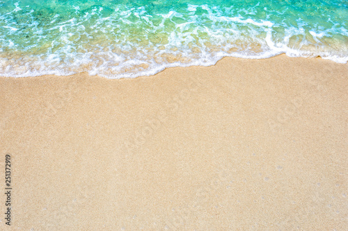 The background of sand with water splash into summer with space for text.