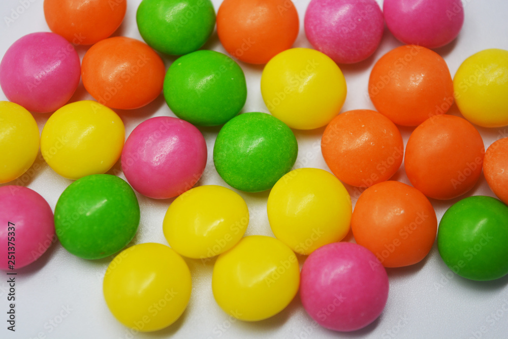 A lot of round sweets like tablets, medicine with bright color and taste. This color sweets are round beads, rainbow color stones. It's popular delicious colorful sweet with sweaty and lively form. A lot of round sweets like tablets, medicine with bright color and taste. This color sweets are round beads, rainbow color stones. It's popular delicious colorful sweet with sweaty and lively form.