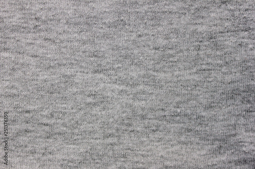 Gray fabric texture background of light material design. Grey cloth pattern of hoodie, sweater, pullover or shirt, casual empty clothing. Close up top view of grey backdrop with empty copy space photo