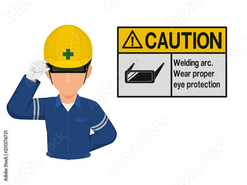 Industrial worker is presenting welding goggles sign