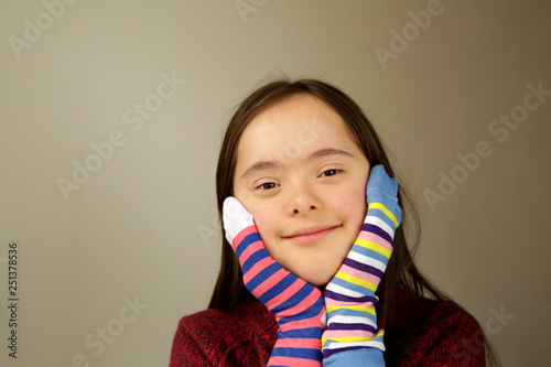 Beautiful girl smiling with different socks