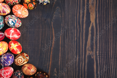 Easter decorated eggs on a wooden background.