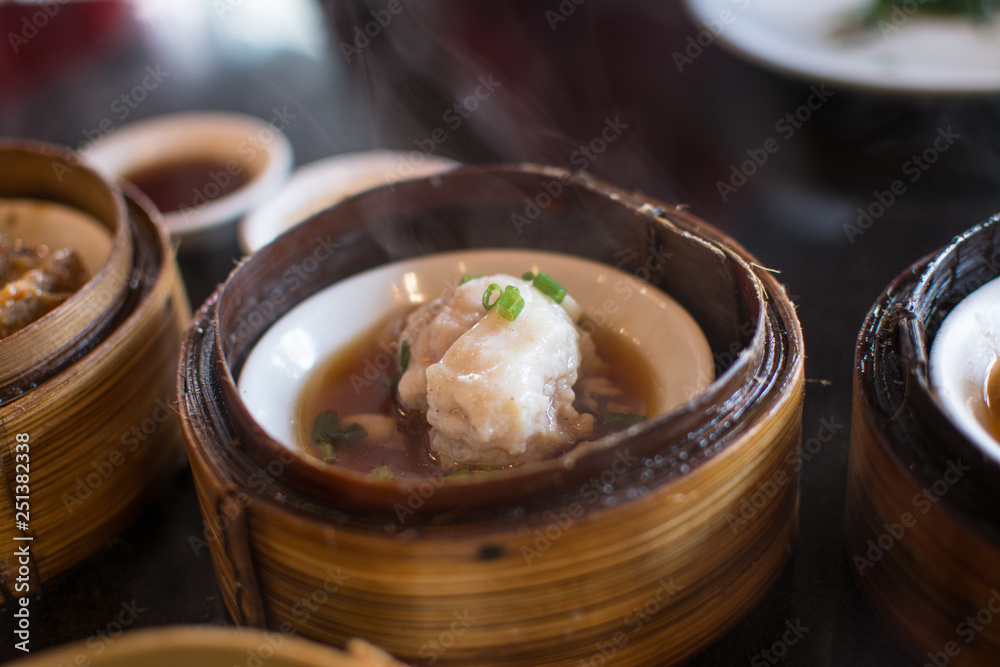 Chinese dim sum in a bamboo steamer box Chinese dim sum in a bamboo steamer box
