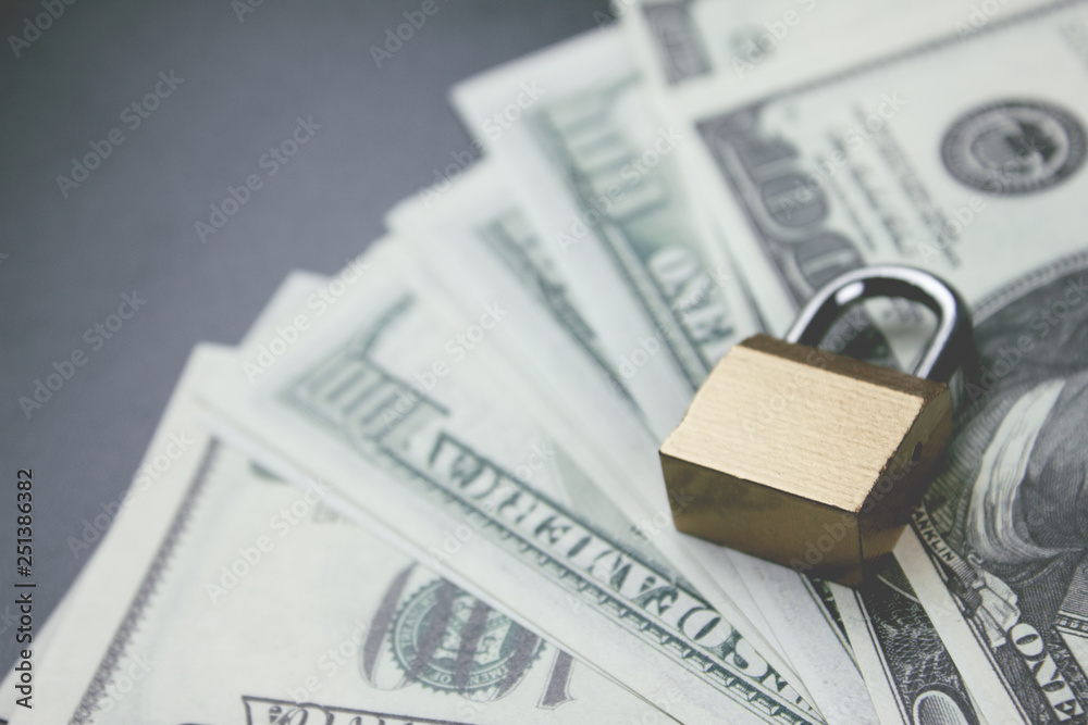 lock and money on the table lock and money on the table