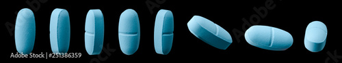 Blue caplet pill on black photo