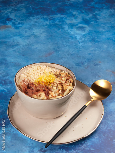 Romanian mucenici or macinici: figure eight shaped pasta, boiled in water with sugar, cinnamon and crushed nuts. Traditional dessert for the Christian feast of the 40 Martyrs of Sebaste photo