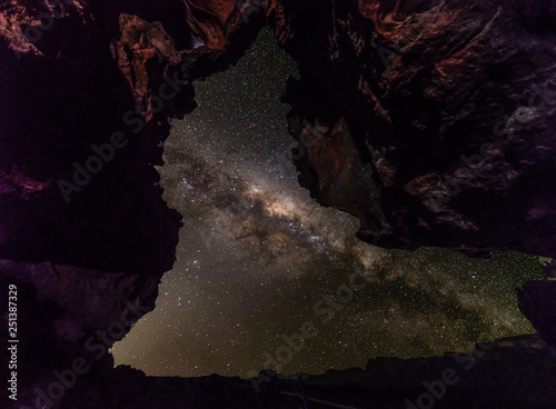 Milky-way photo taken through a natural rock archway