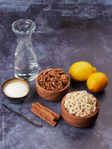 Ingredients for Romanian mucenici or macinici: figure eight pasta, boiled in water with sugar, cinnamon and crushed nuts. Traditional dessert for the Christian feast of the 40 Martyrs of Sebaste photo