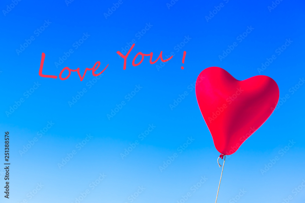 Love Greeting Balloon Image Card Motif / Flying heart shaped red helium balloon tied by rope at blue sky background and wavy textual message - LOVE YOU!