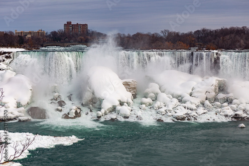 Wallpaper Mural Niagara Falls CANADA - February 23, 2019: Winter frozen view at the American side of beautiful Niagara Falls cower with snow and ice Torontodigital.ca