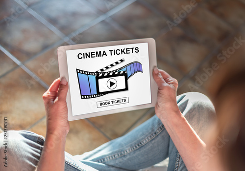 Online cinema tickets booking concept on a tablet