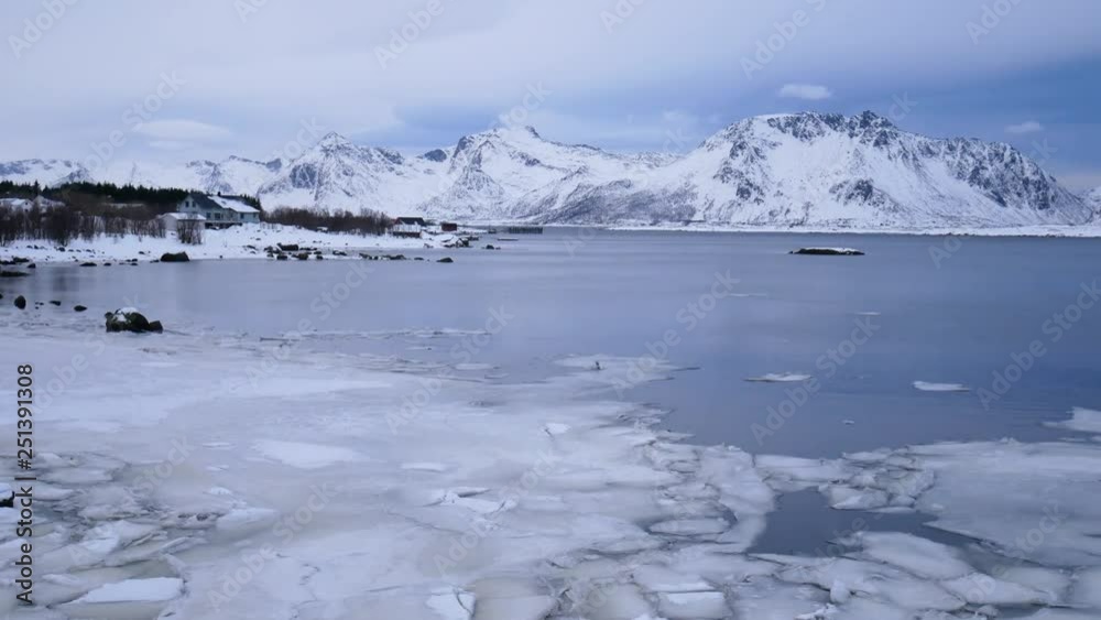 frozen sea and snow-covered mountains, winter in Lofoten Islands, Norway frozen sea and snow-covered mountains, winter in Lofoten Islands, Norway