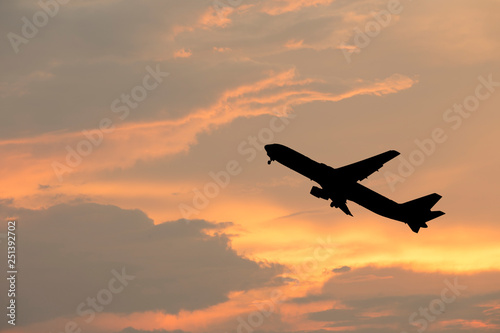 airplane taking off airport sky-diving industry cargo business, concept: passenger Commercial modern navigable Travel and business,Silhouette aircraft is flying above skyline sun