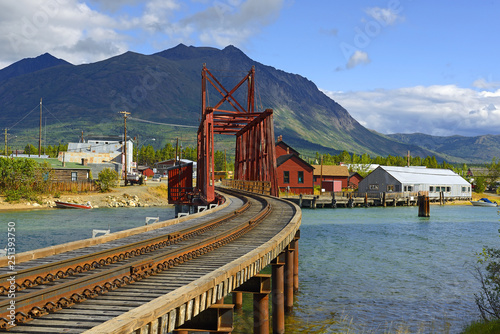 The Iron Rail Bridge of Carcross. Carcross is community in Yukon, Canada, on Bennett Lake and Nares Lake. Carcross is also on the White Pass and Yukon Route railway.