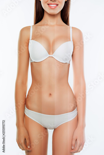 Diet slimming weight loss nutrition concept cropped closeup vertical photo slender she her woman body dressed white underclothes different colored skin show results cream isolated white background