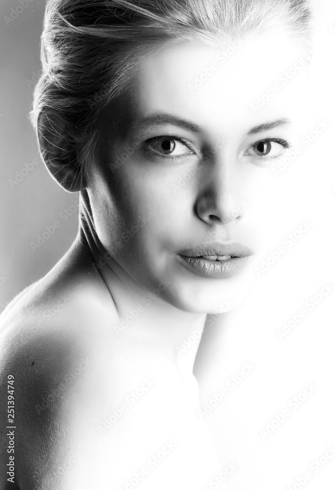Fototapeta premium High contrast black and white portrait of a beautiful girl