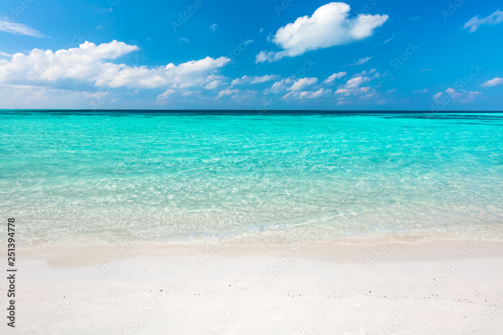 Blue ocean and sandy beach on Maldives.