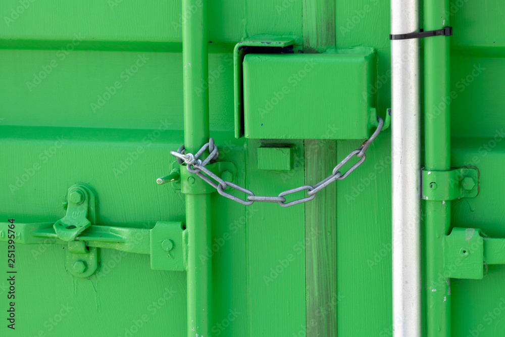 Green storage container locked with chain Green storage container locked with chain