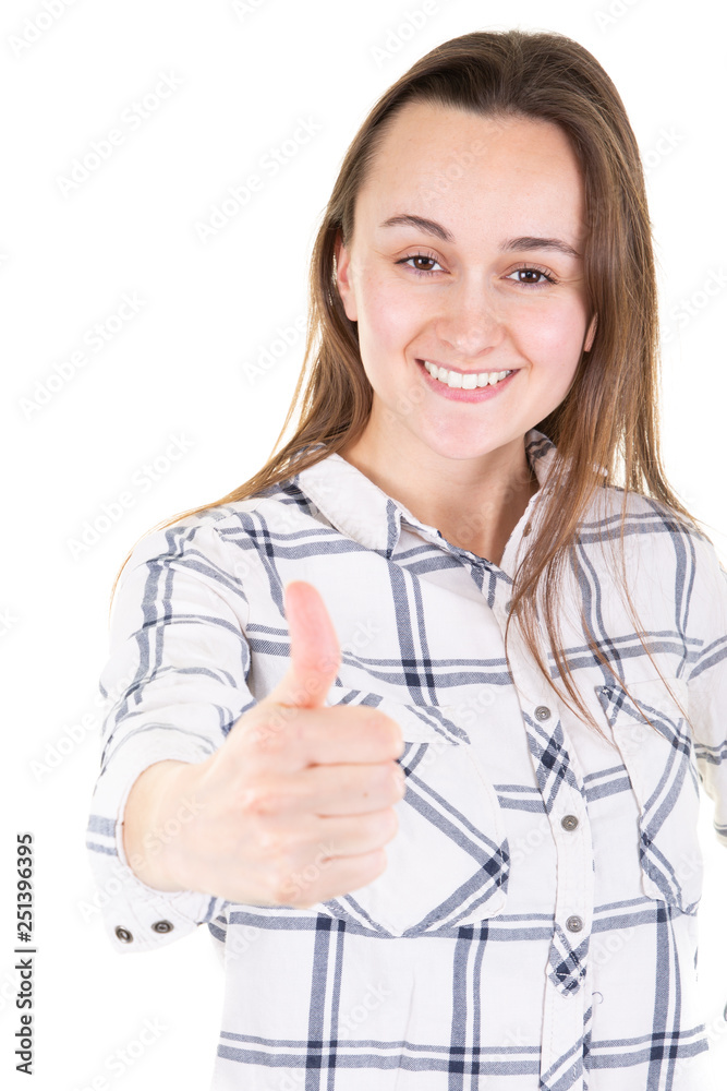 Pleased smiling woman showing thumb up and looking at camera Pleased smiling woman showing thumb up and looking at camera