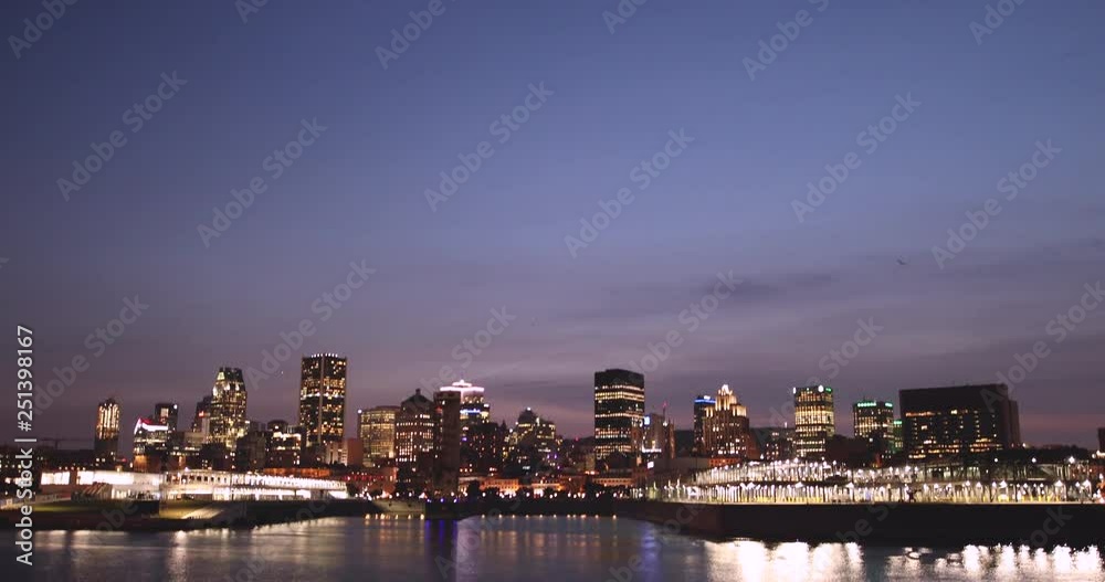 Montreal Quebec Canada downtown city skyline view over the St. Lawrence marina harbor at night Montreal Quebec Canada downtown city skyline view over the St. Lawrence marina harbor at night