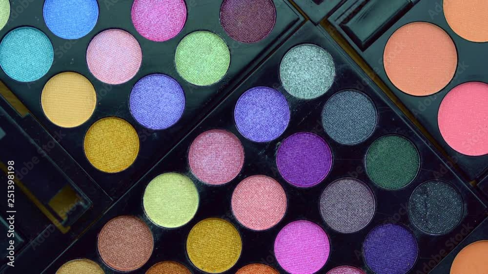 Multi Color Shiny eyeshadow and Rotating professional makeup eyeshadows palette for cosmetics 4K footage