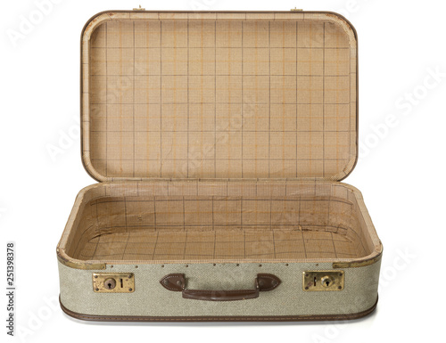 Opened shabby vintage suitcase isolated photo