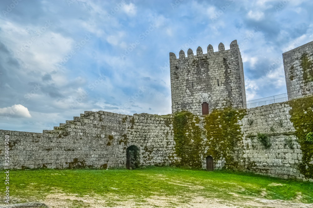 Inside view of medieval Montalegre castle, dramatic sky as background