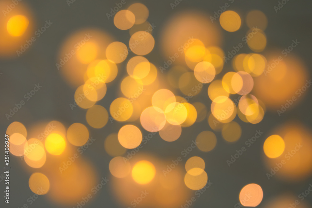 Blurred view of gold lights on dark background. Bokeh effect Blurred view of gold lights on dark background. Bokeh effect
