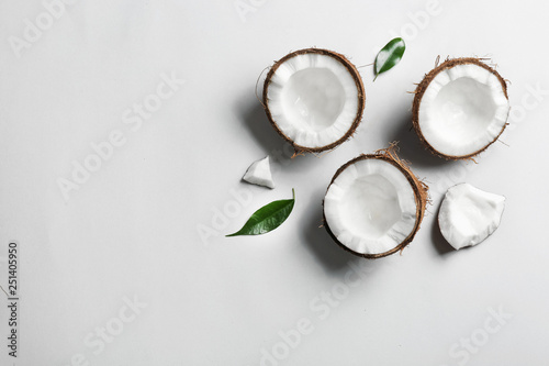 Composition with coconuts on white background, top view