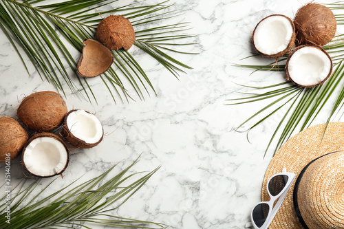 Flat lay composition with coconuts and space for text on marble background