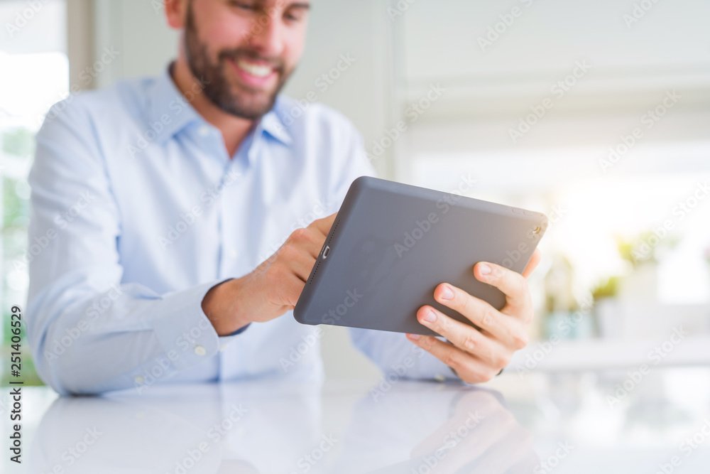 Close up of man hands using tablet and smiling Close up of man hands using tablet and smiling