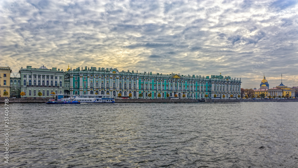 Winter Palace building housing Hermitage museum reflects in Neva river, Saint-Petersburg, Russia.