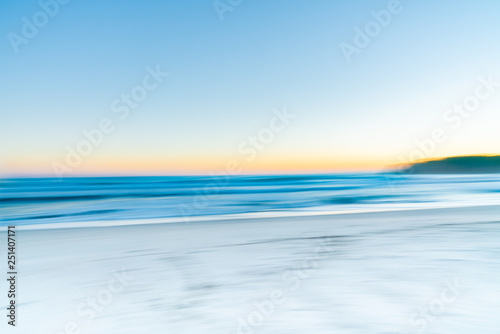 Abstract blur colorful summer sea view at sunrise background at mount Maunganui New Zealand