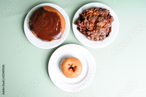 Variety of Breakfast Pastry Food - Donut, Fritter & Cinnamon Bun